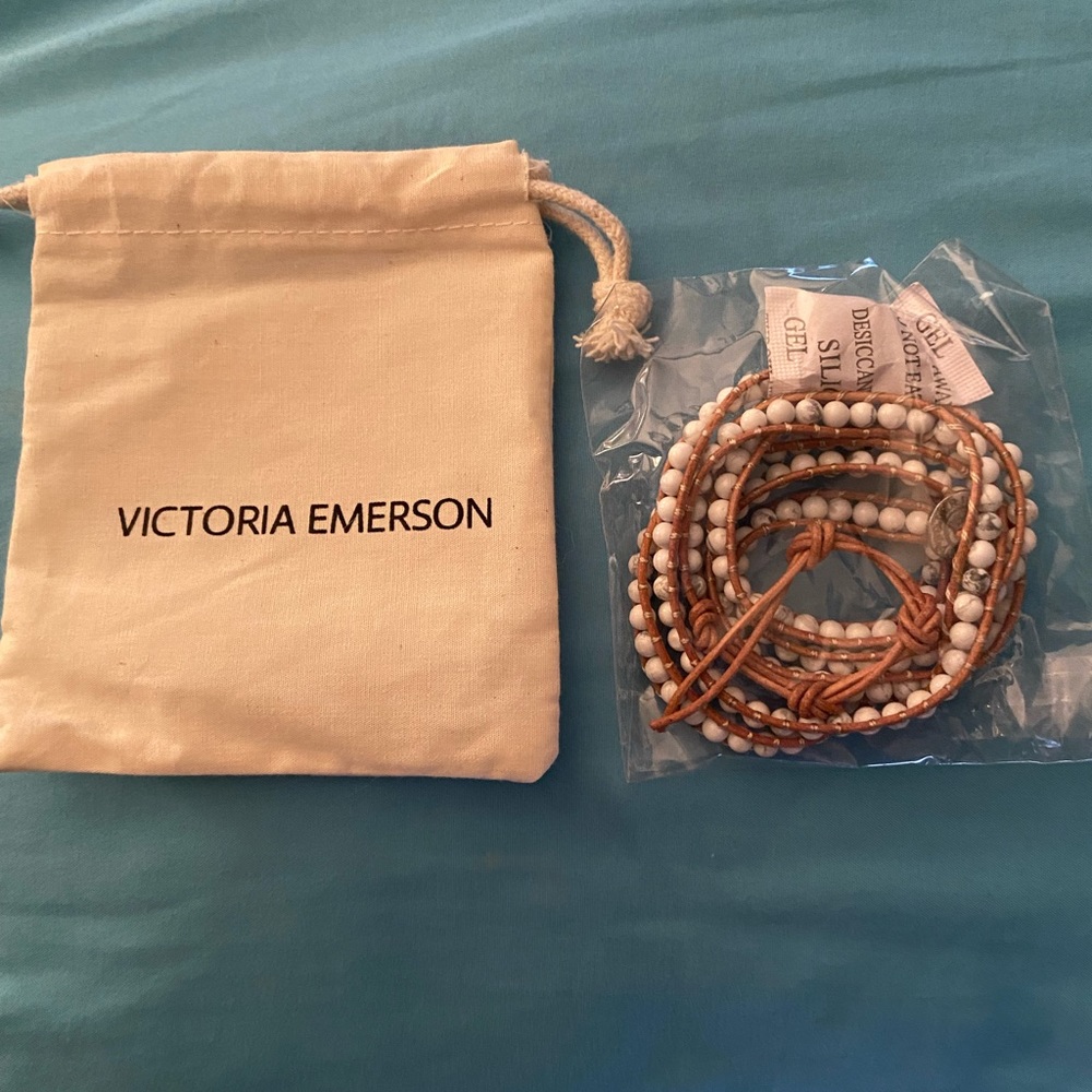 Victoria Emerson 5 wrap bracelet  white beads with a variation on a few beds.